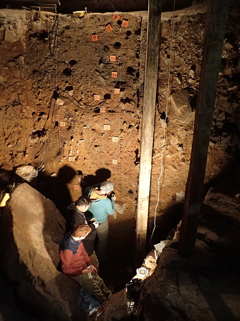 Zenobia Jacobs, Bo Li and Kieran O'Gorman collecting sediment samples in the Main Chamber